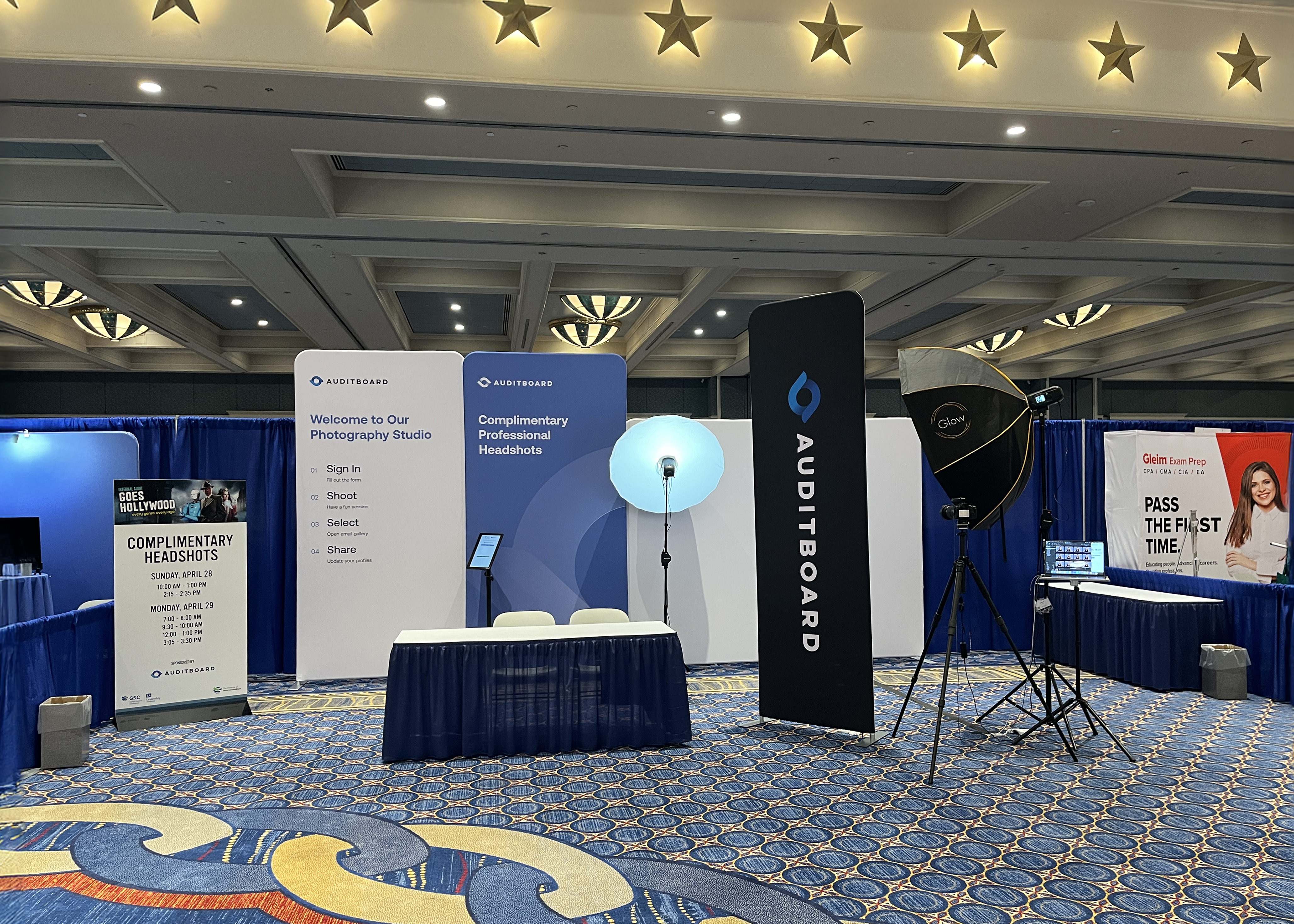 Trade show headshot booth branded signage conference professional photography nationwide travel